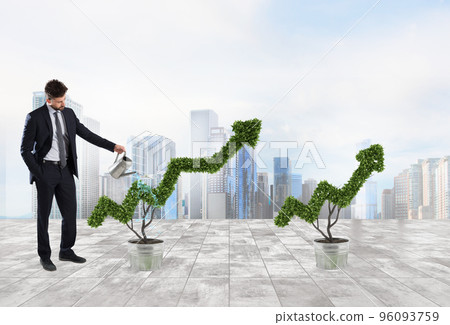 Businessman that watering a plant with a shape of arrow. Concept of growing of company economy . 96093759