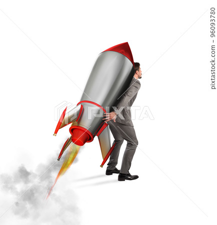Determination and power businessman that holds a rocket isolated on white background 96093780