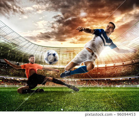 Football scene with competing football players at the stadium Football scene with competing football players at the stadium 96094453