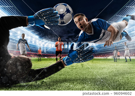 Goalkeeper catches the ball in the stadium 96094602