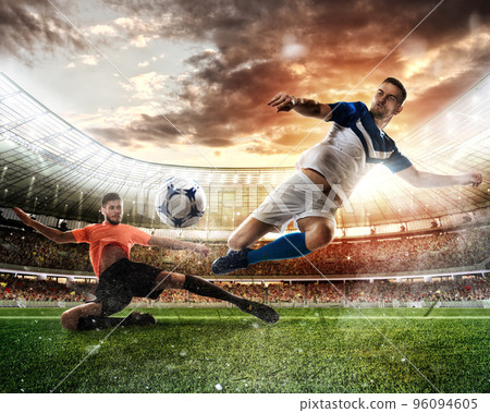 Football scene with competing football players at the stadium Football scene with competing football players at the stadium 96094605