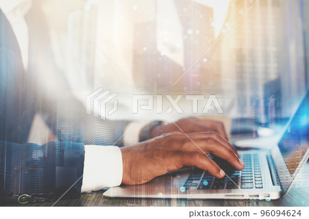 Man working on a laptop. Concept of internet sharing and interconnection Man working on a laptop. Concept of internet sharing and interconnection 96094624