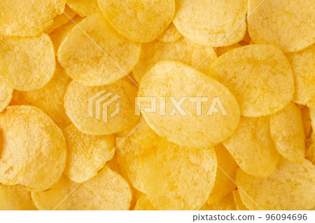 crispy potato chips snack texture background top view crispy potato chips snack texture background top view 96094696