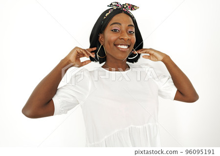 Beautiful young african woman posing over white background 96095191