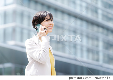 Woman calling in the office district Woman calling in the office district 96095513