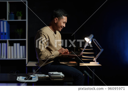 Asian business man working over time at night. business account and finance concept 96095971