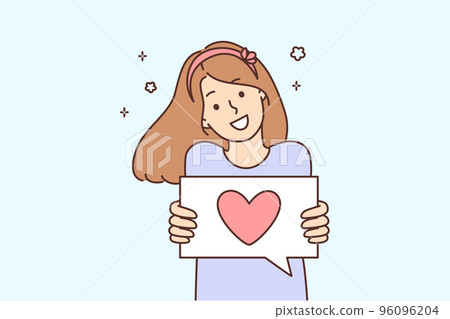 Smiling girl show heart on paper  96096204