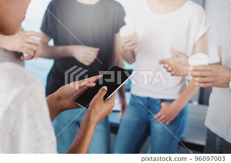 Team of businessmen view project on tablet. Concept of cooperation and technology 96097003