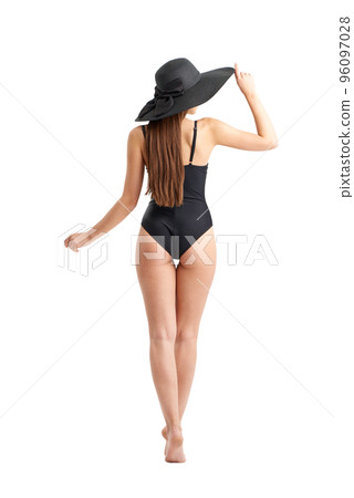 Woman walks in a tropical beach. Isolated on white background 96097028