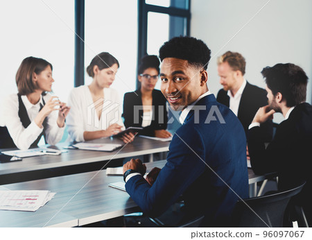 Team of businessmen work together in office. Concept of teamwork and partnership Team of businessmen work together in office. Concept of teamwork and partnership 96097067