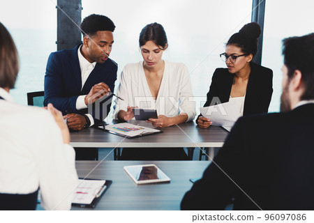 Team of businessmen work together in office. Concept of teamwork and partnership 96097086