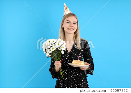 Concept of Happy Birthday with attractive girl on blue background 96097822