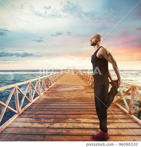 Exercises of gymnastics on a pier Exercises of gymnastics on a pier 96098320
