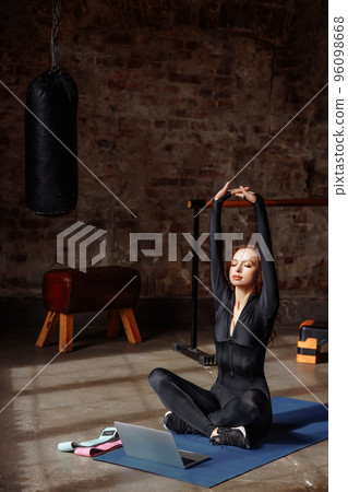 Portrait of a young female online trainer Portrait of a young female online trainer 96098668