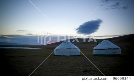 Cloud over the yurts at the shore of Song Kol Lake at the dawn, Kyrgyzstan Cloud over the yurts at the shore of Song Kol Lake at the dawn, Kyrgyzstan 96099344