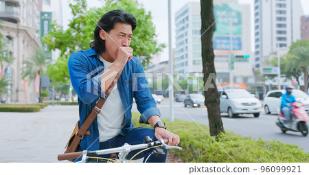 man cough riding bike 96099921