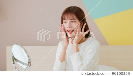 woman doing skincare woman doing skincare 96100209