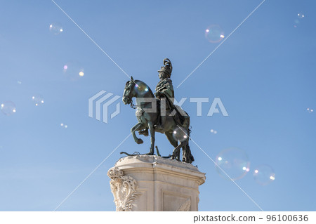 soap bubbles in the air with historical structures in the background 96100636