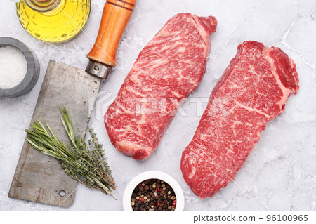 Prime marbled beef steaks. Raw striploin steak Prime marbled beef steaks. Raw striploin steak 96100965