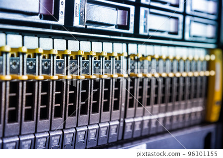 Row of hard drives serving as data storage inside server room Row of hard drives serving as data storage inside server room 96101155
