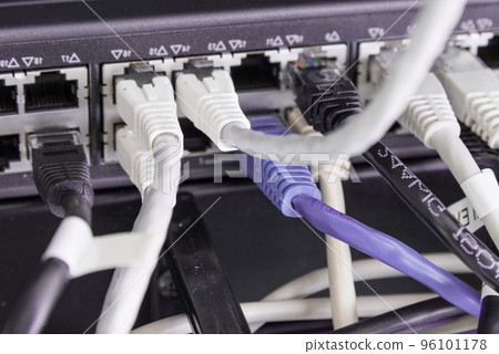 backside of server rack with patch cable connected into the switch panel backside of server rack with patch cable connected into the switch panel 96101178