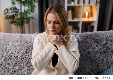 Sick woman having sore throat Sick woman having sore throat 96101654