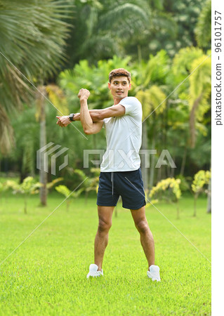 Full length of runner in sport clothing warm up before sports training outdoors. Fitness, sport and healthy lifestyle concept Full length of runner in sport clothing warm up before sports training outdoors. Fitness, sport and healthy lifestyle concept 96101757