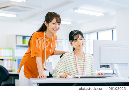 Young female engineer working in an office 96102023