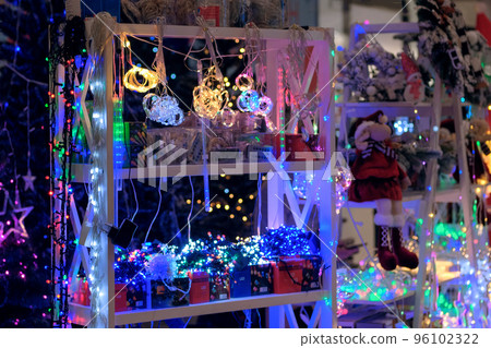 Christmas market. Christmas garland, souvenirs and toys for decoration in store. Christmas market. Christmas garland, souvenirs and toys for decoration in store. 96102322