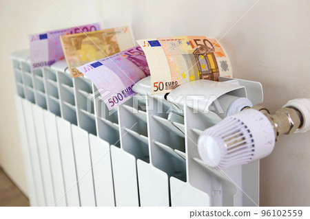 Radiator and money. The concept of payment for heating. Radiator and money. The concept of payment for heating. 96102559