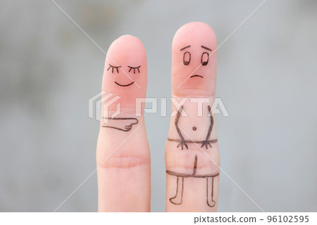 Fingers art of the wife laughs at her husband. Concept of impotence. Divorce. Fingers art of the wife laughs at her husband. Concept of impotence. Divorce. 96102595