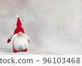 Christmas handmade gnome in red hat holiday banner on light winter background 96103468