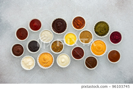 Different types of sauces in bowls 96103745