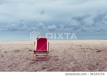 Empty outstanding red beach chair on the seashore, beach vacation and relaxing concept. 96104159