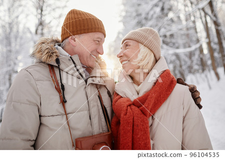 Loving Senior Couple Outdoors in Winter Loving Senior Couple Outdoors in Winter 96104535