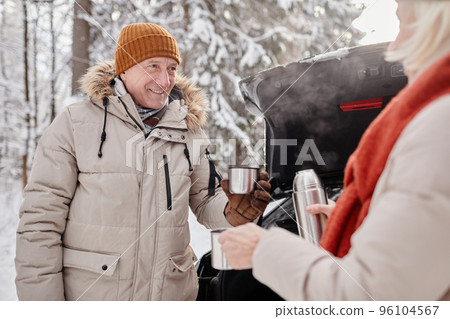 Senior Couple Sharing Hot Drinks in Winter Senior Couple Sharing Hot Drinks in Winter 96104567