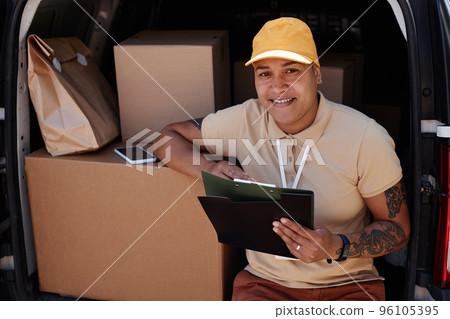 Female Delivery Worker In Van Trunk Female Delivery Worker In Van Trunk 96105395