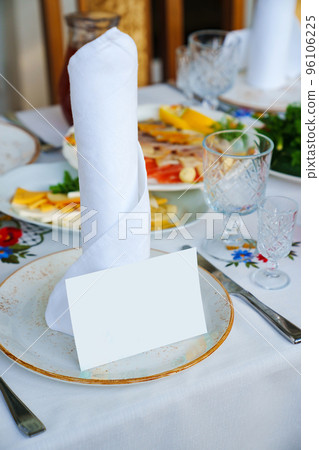 table setting. a plate with a napkin and a card for the guest's name.  96106225