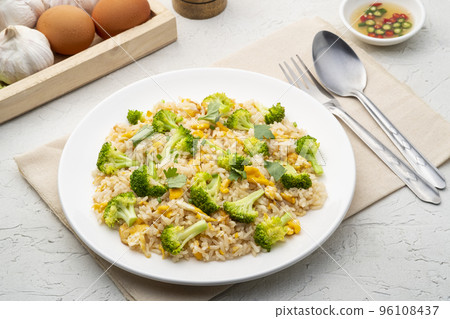 Fried rice with broccoli and egg in white plate.Easy food 96108437