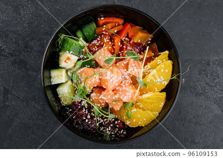 Poke bowl with salmon, cucumber, pepper and orange Poke bowl with salmon, cucumber, pepper and orange 96109153