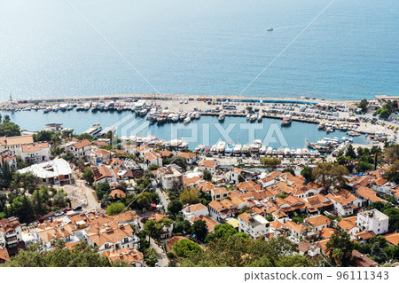 View of the panorama of the Turkish city of Kas from above. Tourist attractions of Turkey and Mediterranean Sea. Travel, vacation, tourism concept. View of the panorama of the Turkish city of Kas from above. Tourist attractions of Turkey and Mediterranean Sea. Travel, vacation, tourism concept. 96111343