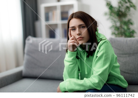 Sad woman at home 96111742