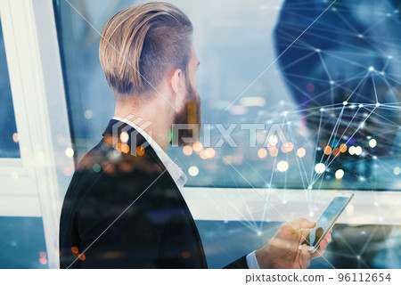 Smartphone of a businessman that shares multimedia with internet connection Smartphone of a businessman that shares multimedia with internet connection 96112654