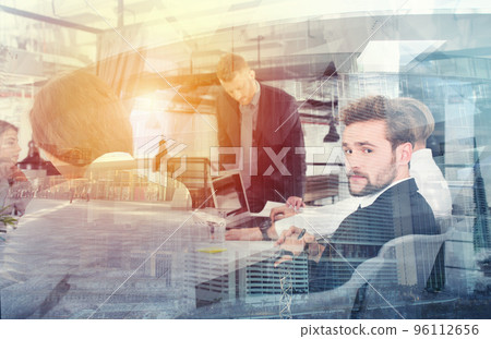 Businessmen that work together in office. Concept of teamwork and partnership. double exposure Businessmen that work together in office. Concept of teamwork and partnership. double exposure 96112656