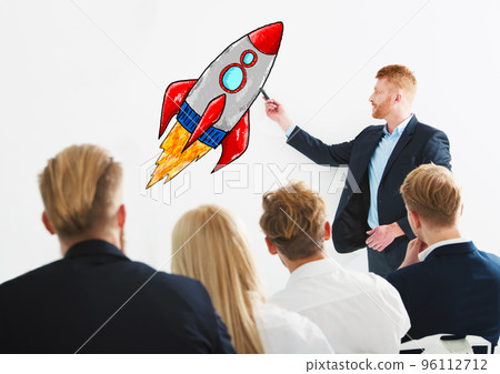 Businessman drawing a rocket during a training meeting. Concept of business improvement and enterprise startup 96112712