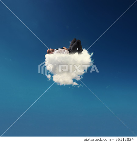 Stressed businessman relaxing on a soft cloud 96112824