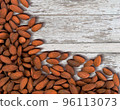 Almond nuts on a white wooden background. 96113073