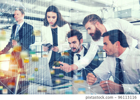 Businessman in office connected on internet network with network effects. concept of startup company. double exposure Businessman in office connected on internet network with network effects. concept of startup company. double exposure 96113116