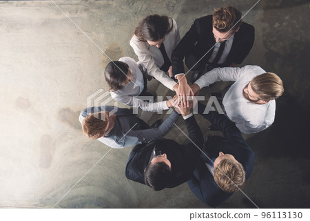 Business people putting their hands together. Concept of integration, teamwork and partnership Business people putting their hands together. Concept of integration, teamwork and partnership 96113130