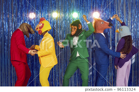 Eccentric people with animals heads dance in colourful suits on blue bright background. 96113324